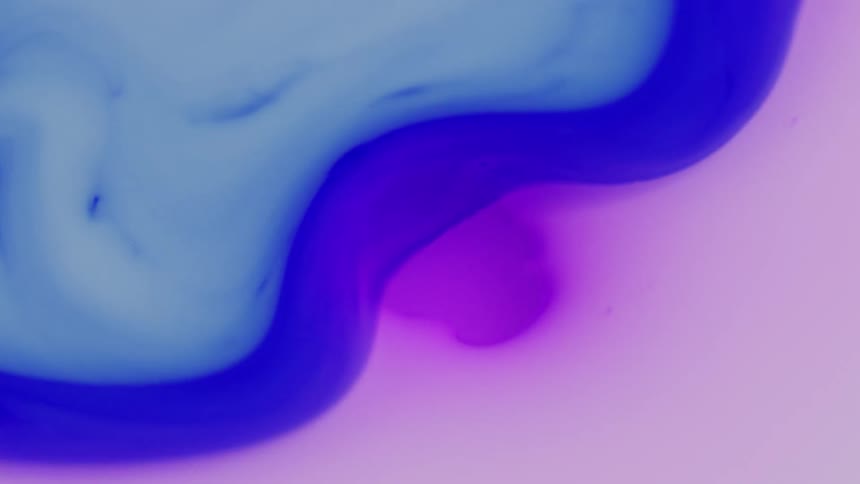 A blue liquid wraps around a purple sphere