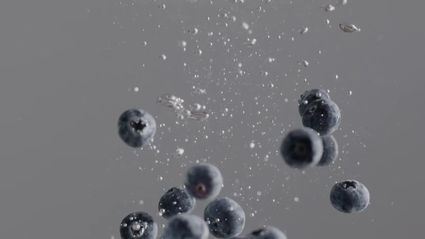 Blueberries float in water