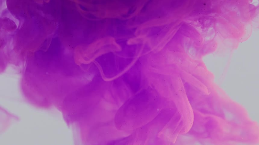 Purple dye rising through pale liquid