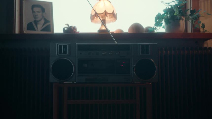 An old radio is by the window