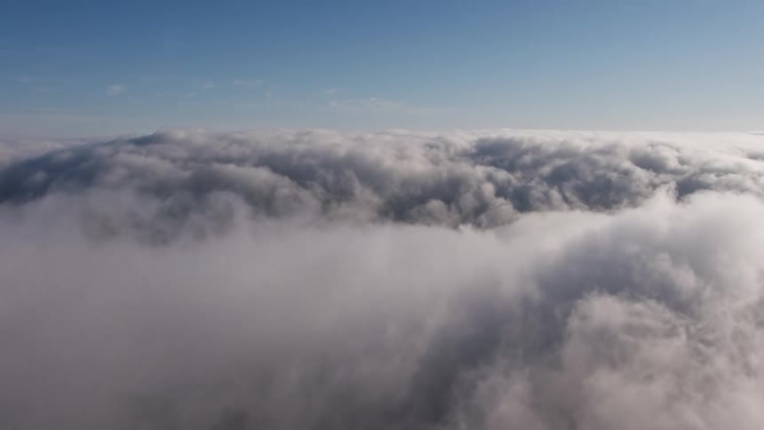 Aerial footage showcasing a dense marine layer above Los Angeles California providing a beautiful view of the cloudy skies