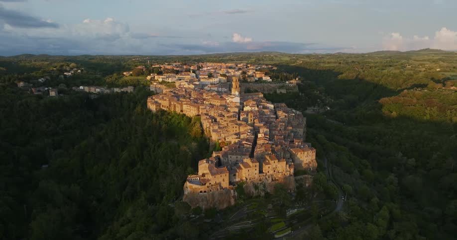 A town sits atop a cliff in a canyon