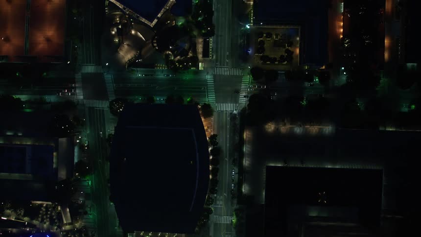 A breathtaking 4K aerial view of Downtown Los Angeles at night showcasing the beautiful city streets buildings and lights