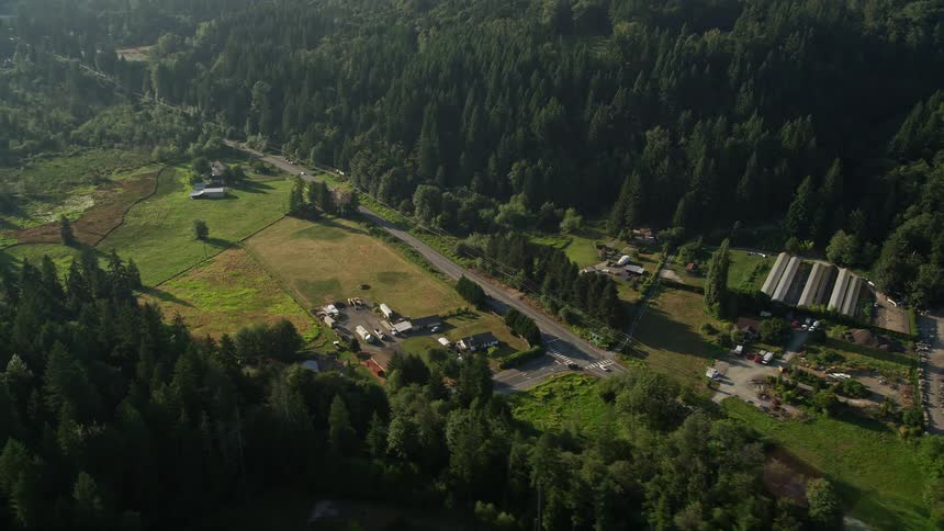 Aerial footage of small farms and greenhouses along Redmond Fall City Road in Redmond Washington showcasing the vibrant countryside and agricultural landscapes