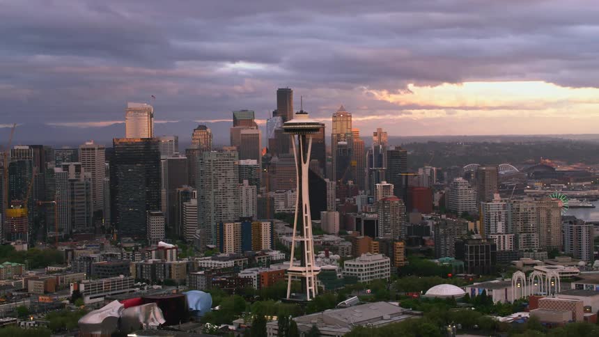 An aerial view of a dense cityscape and the space needle near the waterfront
