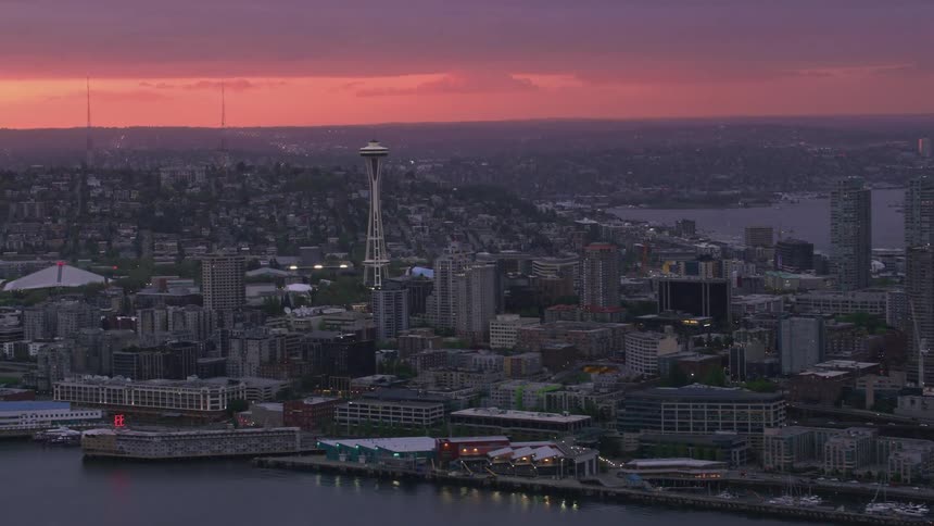 An aerial view of seattle and the space needle at dawn