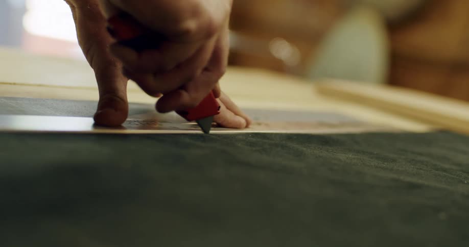 A person is cutting fabric