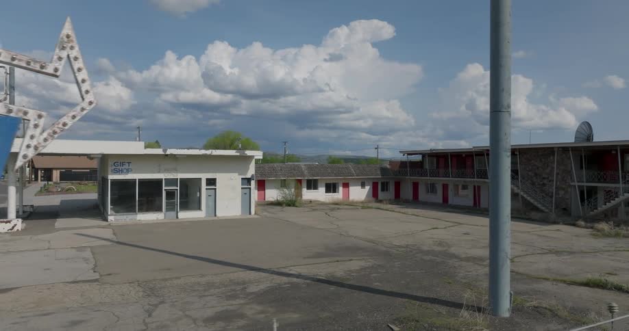 Slow traverse along the edge of an abandonded 1970's motel property