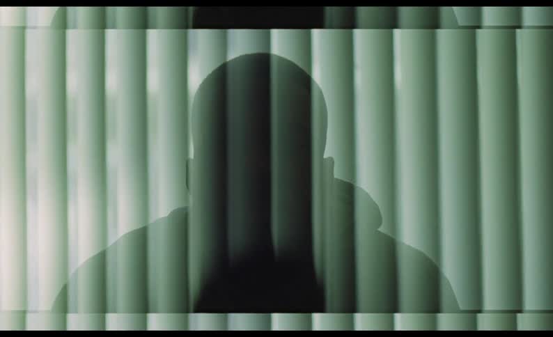A silhouette of a mans head and shoulders being brought up on a computer animation