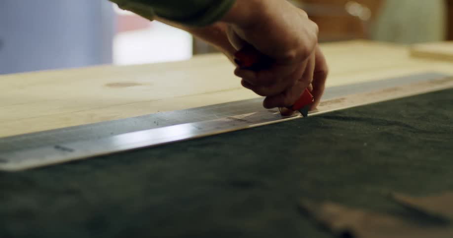 A person is cutting a piece of fabric