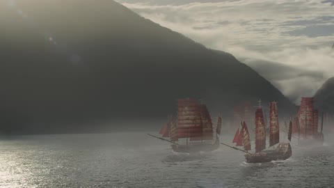 Boats sail together in the water