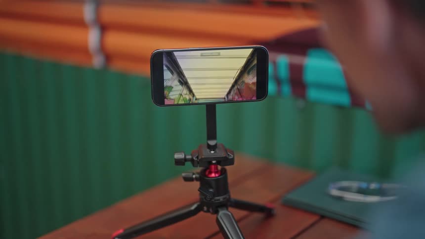 A man watches video on his smartphone