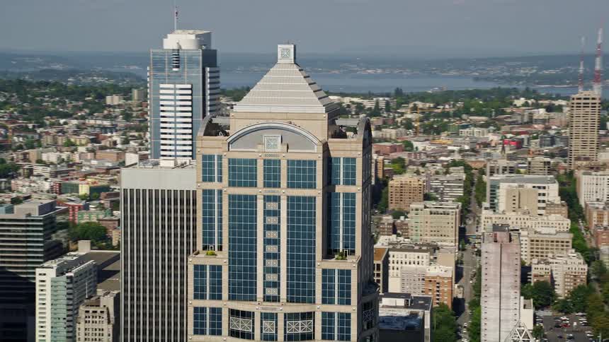 Aerial footage of downtown Seattle's 1201 Third Avenue Tower capturing the vibrant metropolis on a sunny day