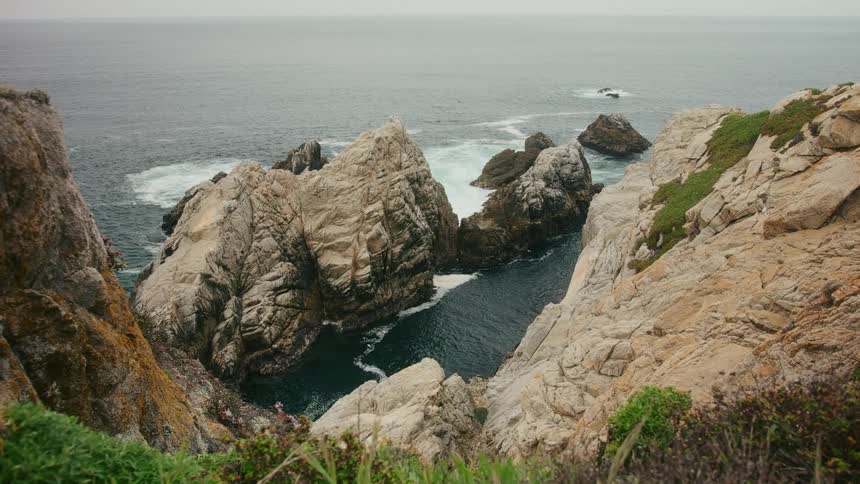 Coastal rock formations next to the ocean at daytime