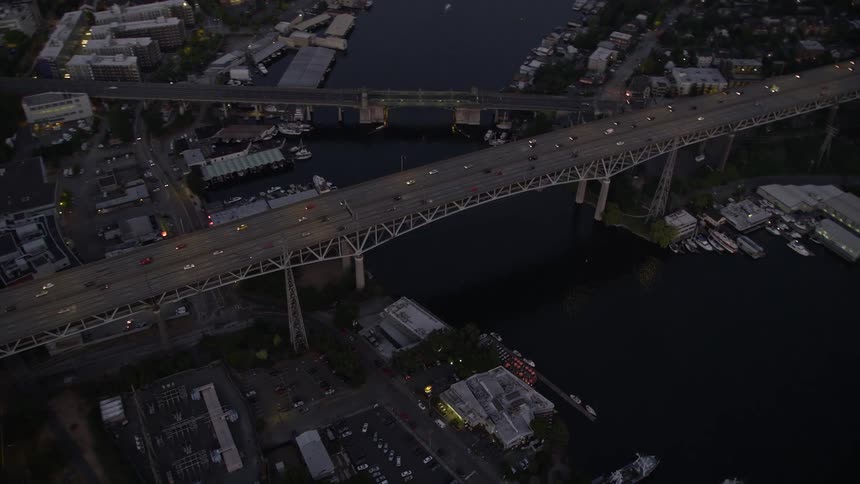 Bird's eye view of light traffic as it crosses the Ship Canal Bridge during twilight in Seattle Washington