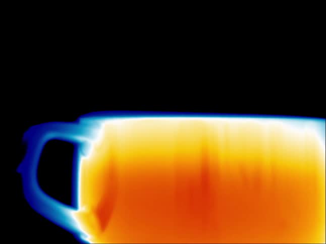 Close up of a cup filled with a hot beverage seen through infrared thermal imagery