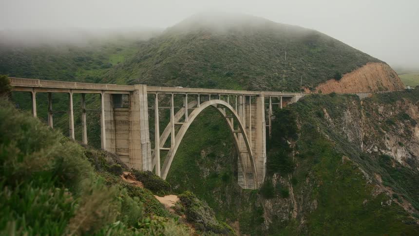 Cars travel on the bridge on the mountain