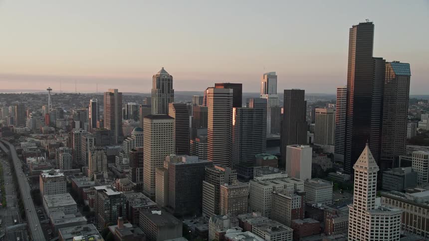 Aerial footage of downtown Seattle's south side at sunset capturing the stunning city skyline and its towering skyscrapers