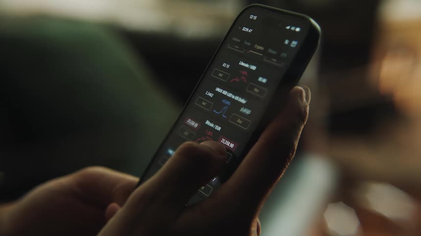 A close up of a person using their cellphone and scrolling through the screen