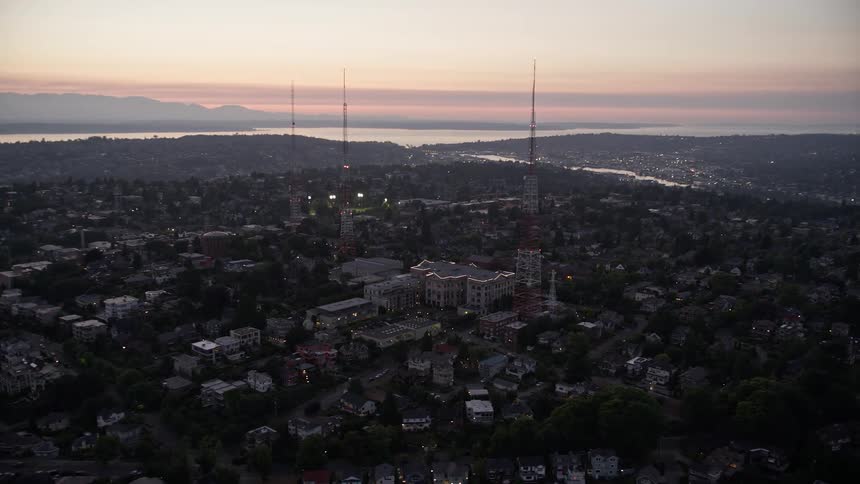 A stunning aerial view of Queen Anne High School and radio towers during sunset in Seattle Washington