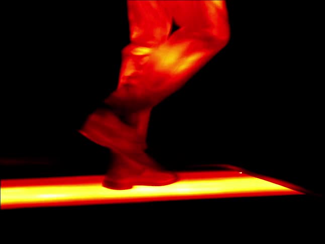 A person is walking on a treadmill in infrared