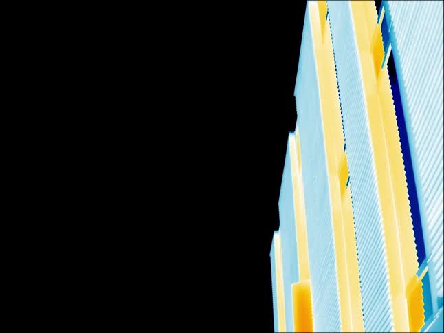 Exterior facade of a building or fence seen with infrared thermal imagery