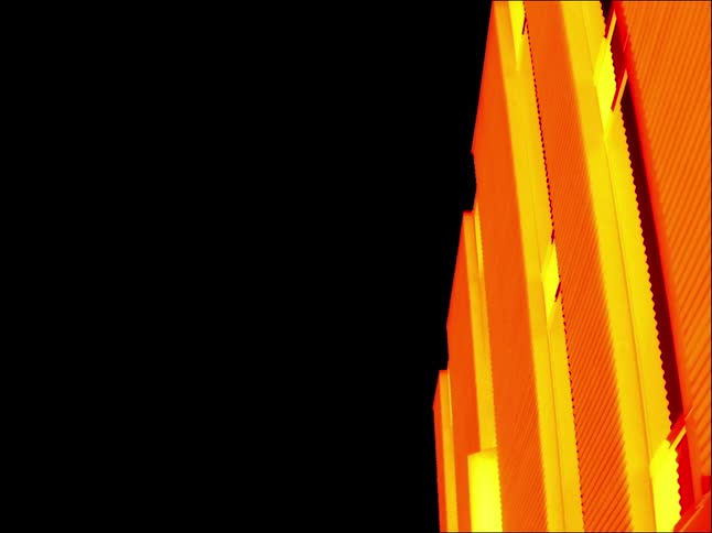 Bright orange and yellow interconnected panels contrast with black of night