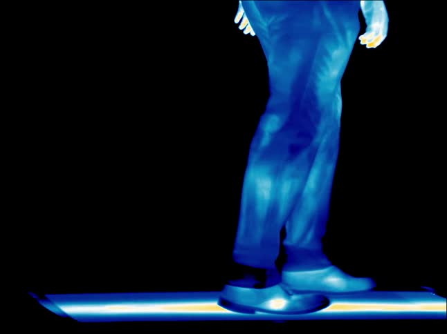 Person under infrared walks across flat surface
