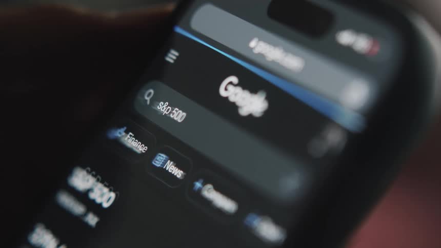 Stock prices are checked on a smartphone