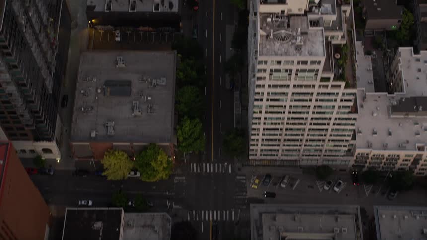 Bird's eye view of 1st Avenue in Downtown Seattle Washington at sunset showcasing the city streets and skyline surrounded by clear skies