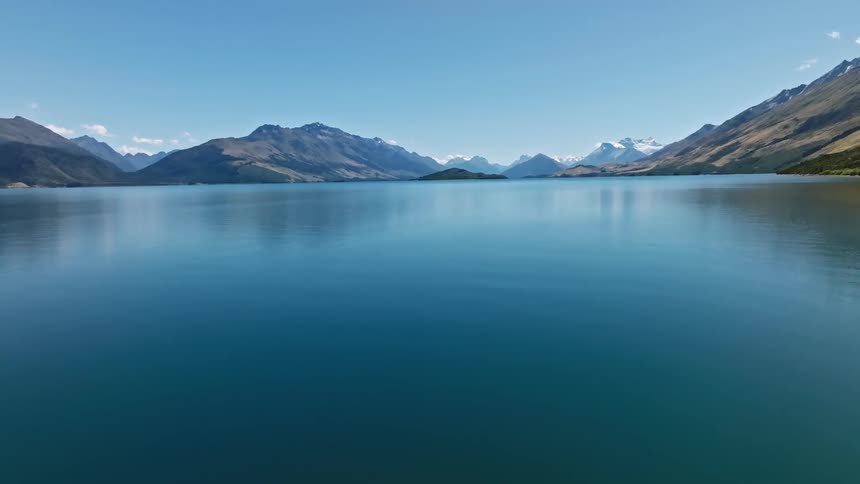 Low level aerial of calm lake wakatipu