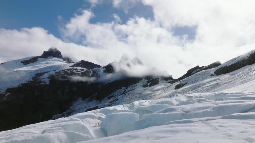Aerial view of snow covered mountain glacier