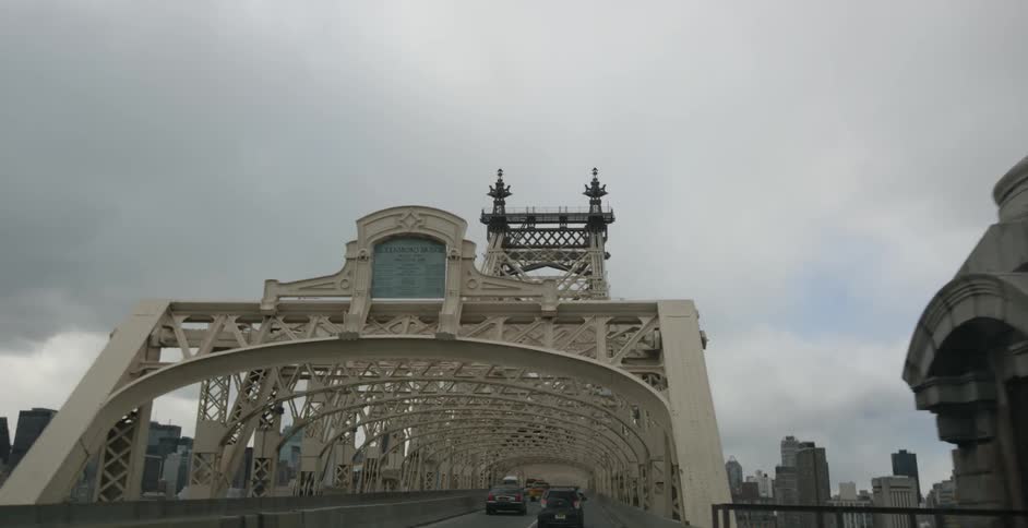 Driving over an old bridge in traffic