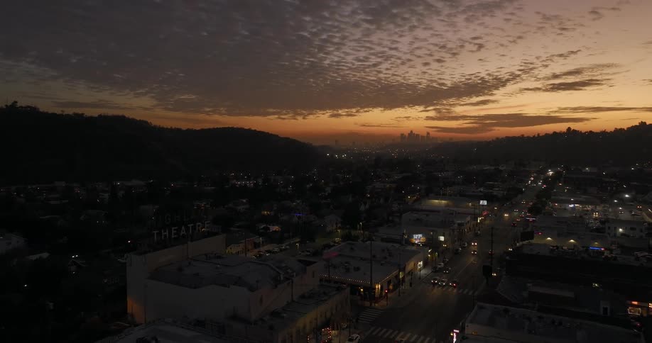 Heavy traffic passes through a mountain town at night