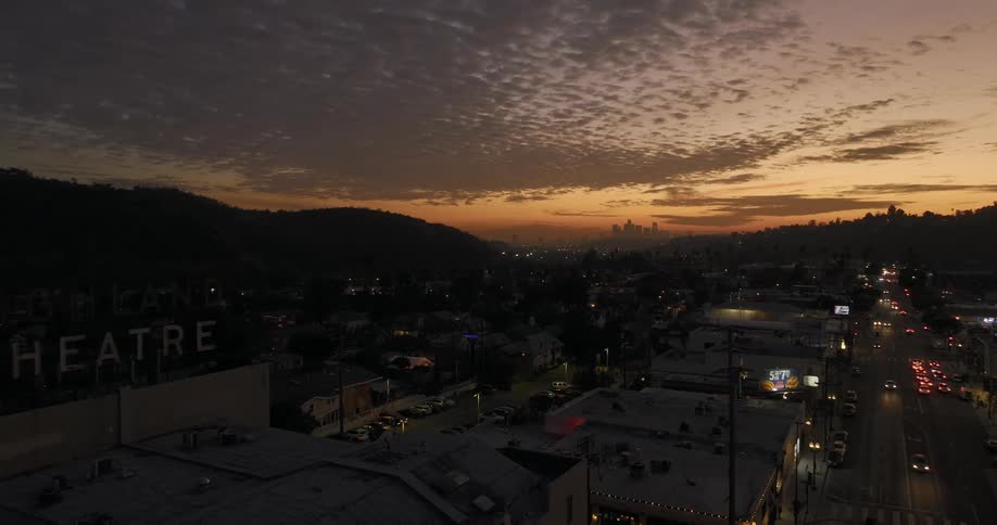 An aerial view of a suburban towns main street at dusk