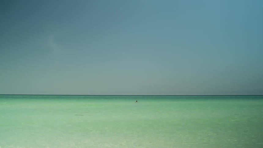 People are swimming in the ocean water