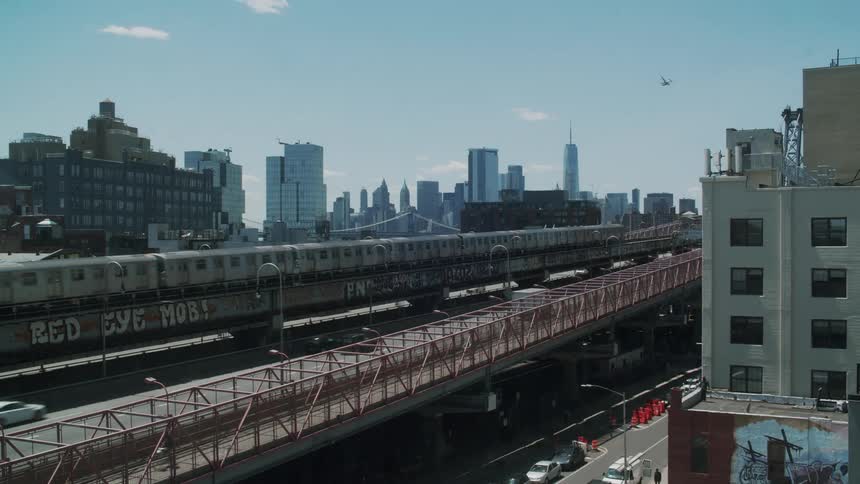 Train passes over the city streets close at daytime