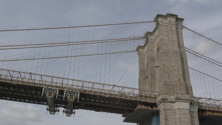 Vehicles are seen traveling over a bridge high above