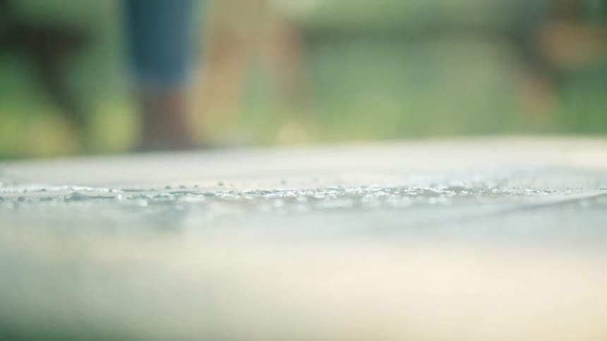 A woman is painting outdoors during midday