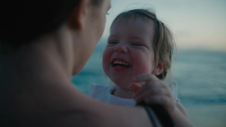The view is of a portrait of mother and daughter at the beach