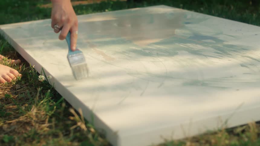 The view is of some one that is painting outdoors