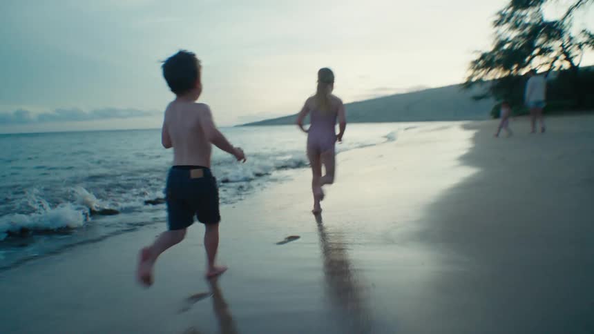 The view is of a family that is on the beach