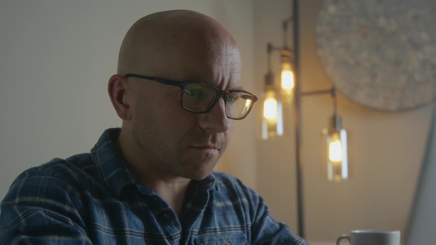 A man works on his laptop