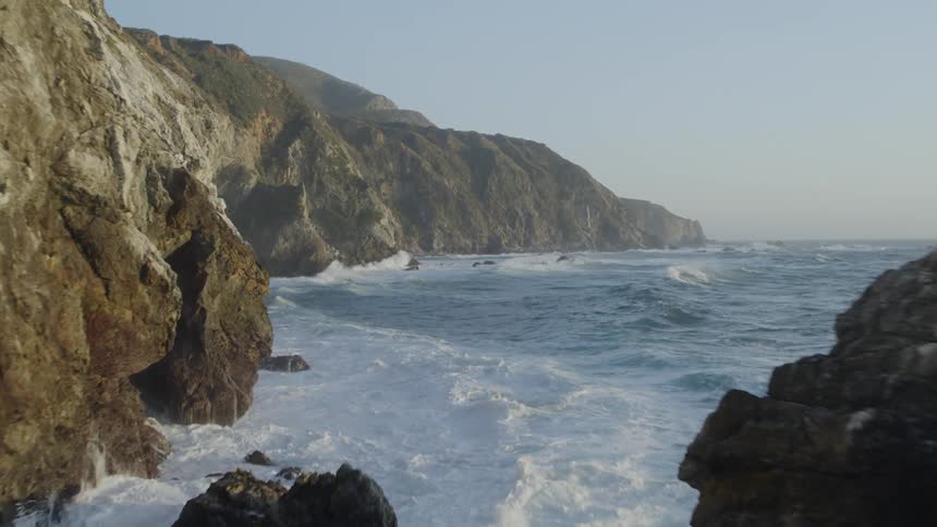 Drone of Big Sur as bird flies past the coast