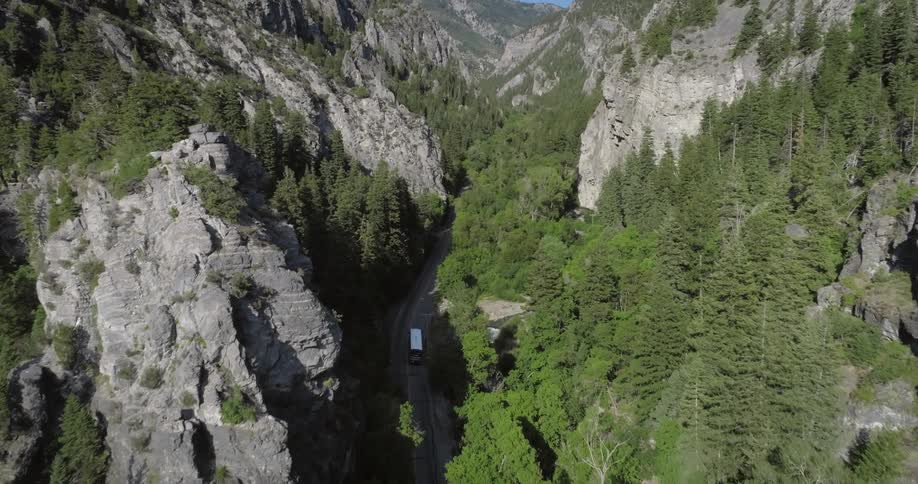 A truck travels on the mountain road