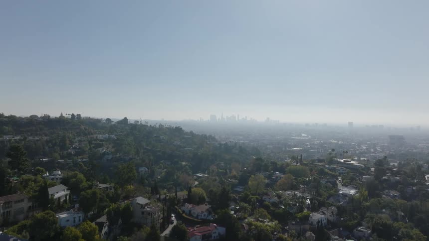 Residential neighborhoods stretch to downtown on a foggy horizon