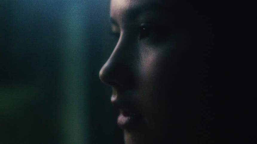 A woman slowly opens her eyes