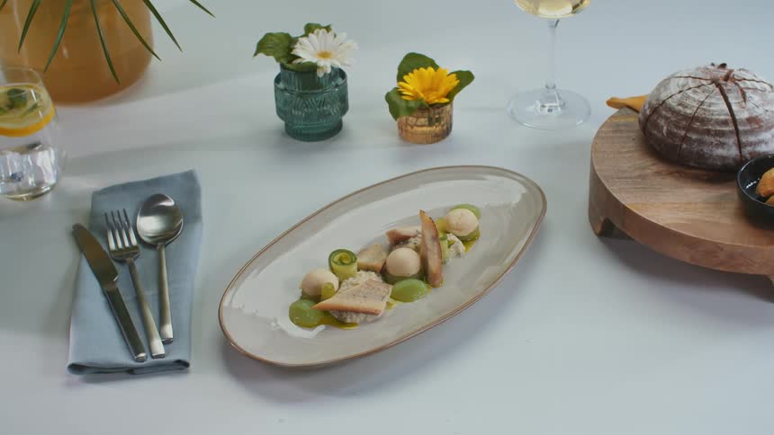A person puts a plate of food down