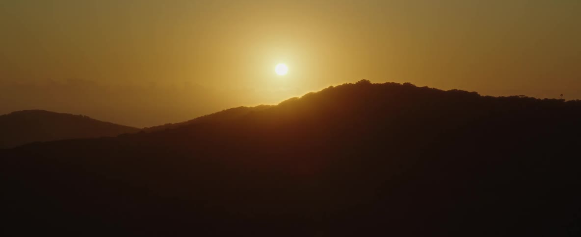 Aerial view of mountain top at sunrise or sunset