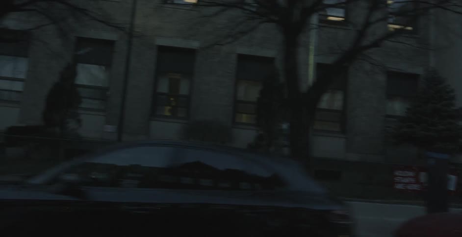 View from a car window as it drives on a city street